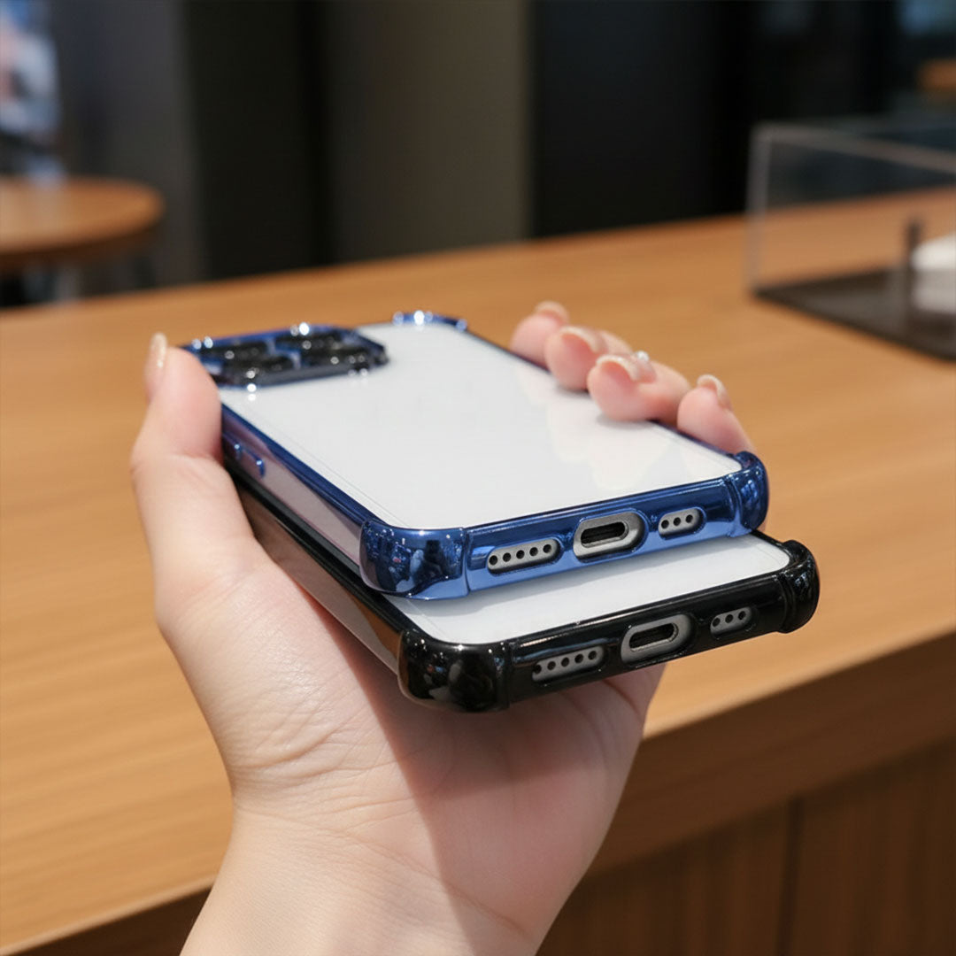 Hand holding two Motorola Edge 60 Pro 5G phone cases, one blue and one black, on a wooden surface.